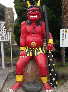 A demon sitting at the entrance to Oniyama Jigoku.