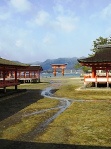 View of the torii gate from the inside of the shrine at low tide.
